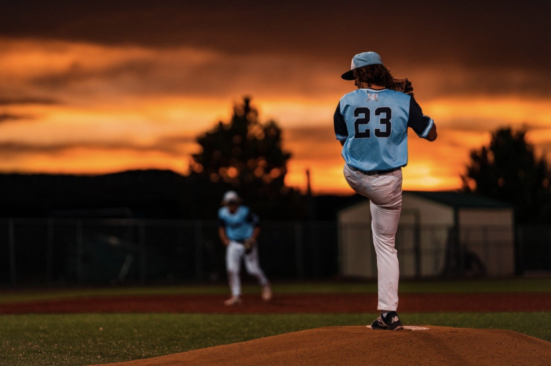 Gameday pitcher on the mound at sunset